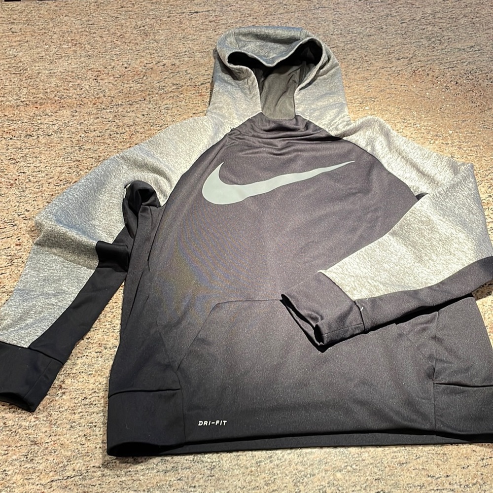 Nike youth Dri-Fit hooded sweatshirt.
